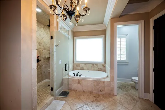 a bathroom with a bathtub and a shower