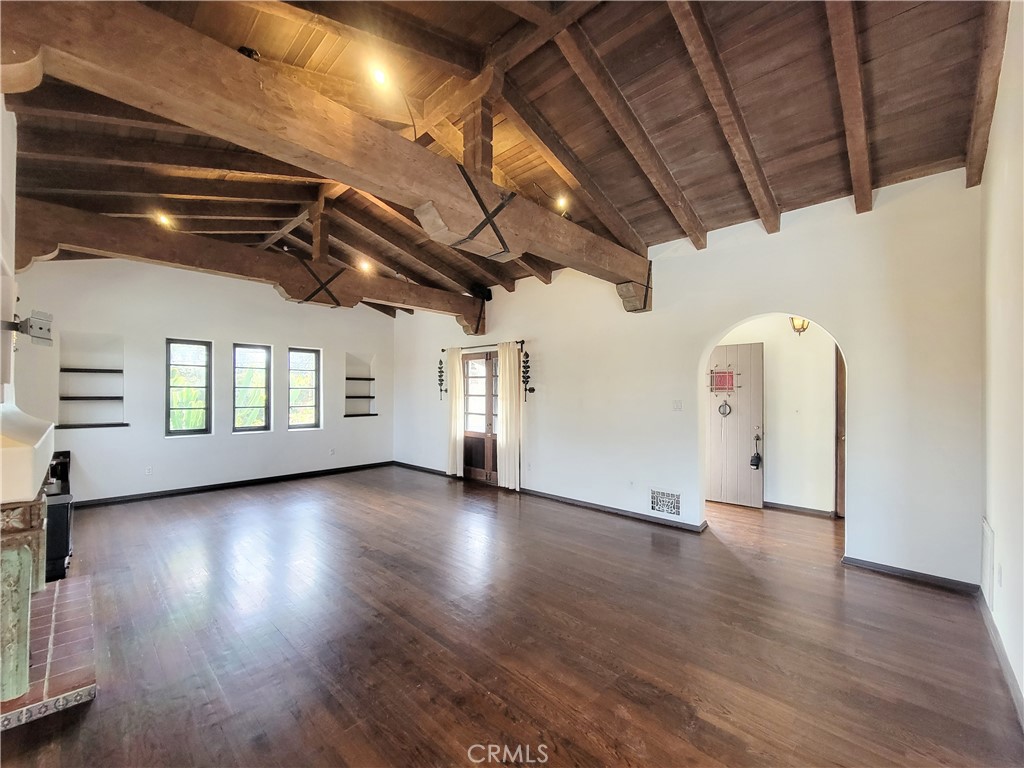 603 Termino Avenue Long Beach, CA 90814 - Photo 3 of 21 a view of a livingroom with wooden floor and a window