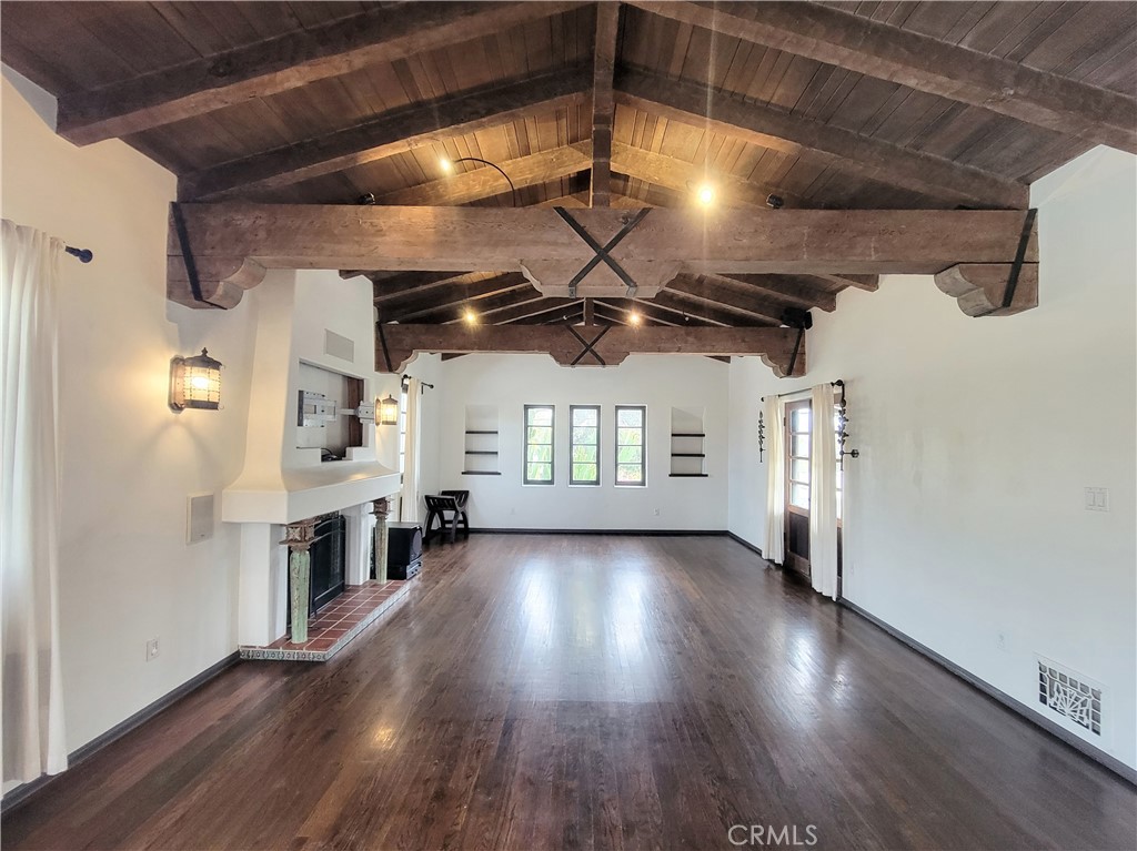 603 Termino Avenue Long Beach, CA 90814 - Photo 4 of 21 a view of an empty room with wooden floor and a ceiling fan