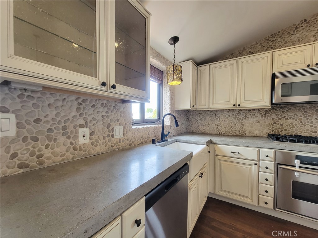 603 Termino Avenue Long Beach, CA 90814 - Photo 8 of 21 a kitchen with a sink and cabinets