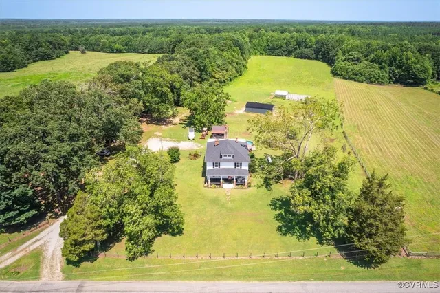 a view of a swimming pool with a yard