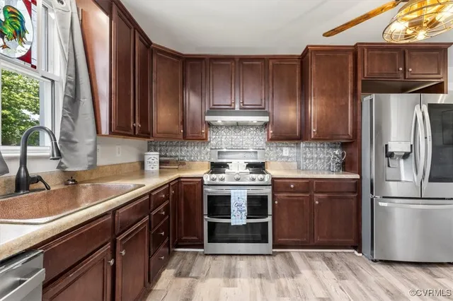 a bedroom with bed and a chandelier