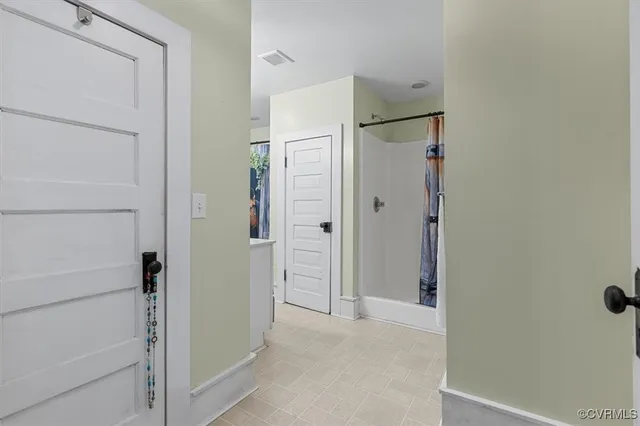 a bathroom with a sink a mirror and shower