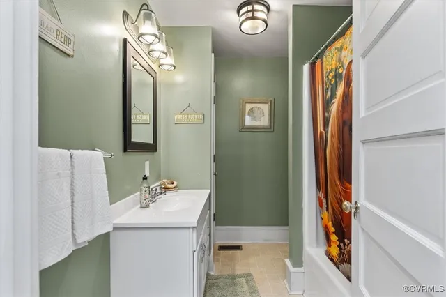 a utility room with dryer and window