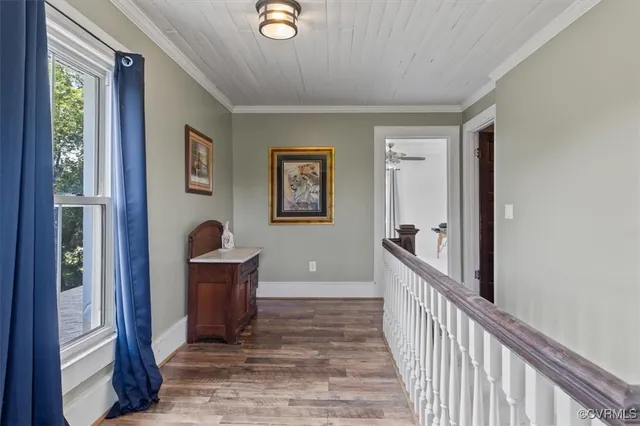 a view of workspace with wooden floor and ceiling fan