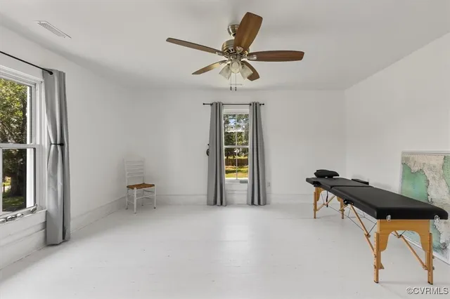 a view of hallway with wooden floor