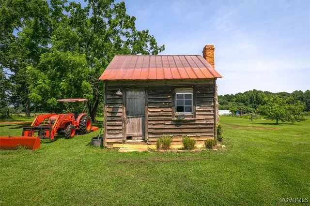 an outdoor space with furniture and garden