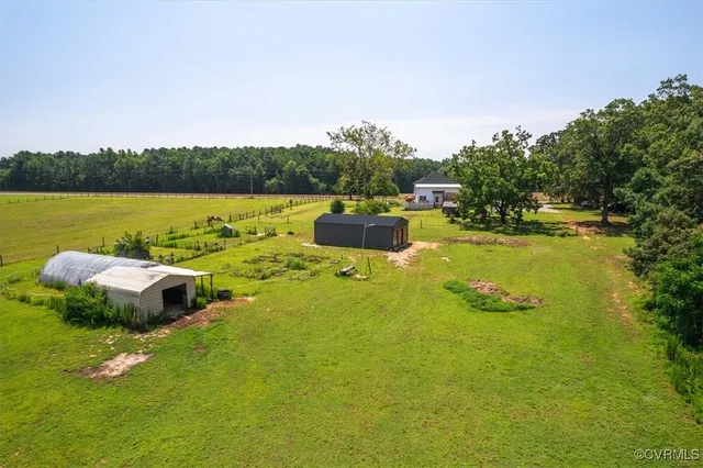 an aerial view of a houses with a lake view