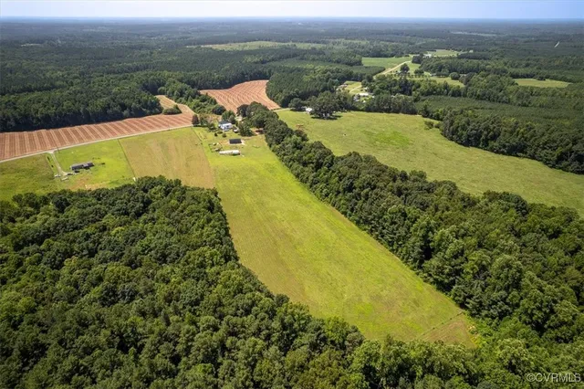 a view of a lake with houses in the back