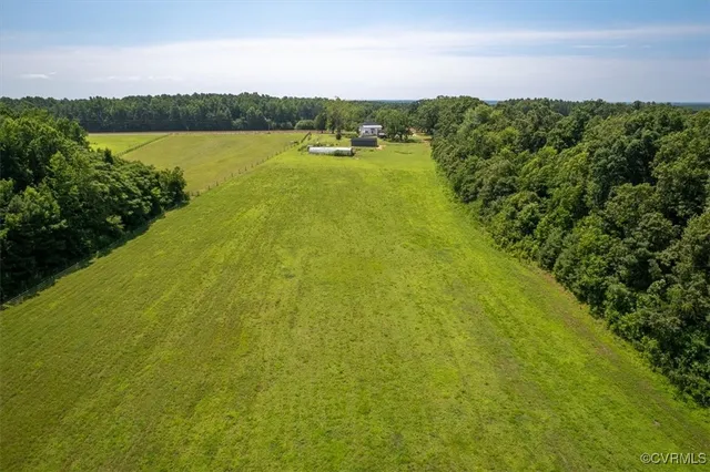 a view of a lake with a yard