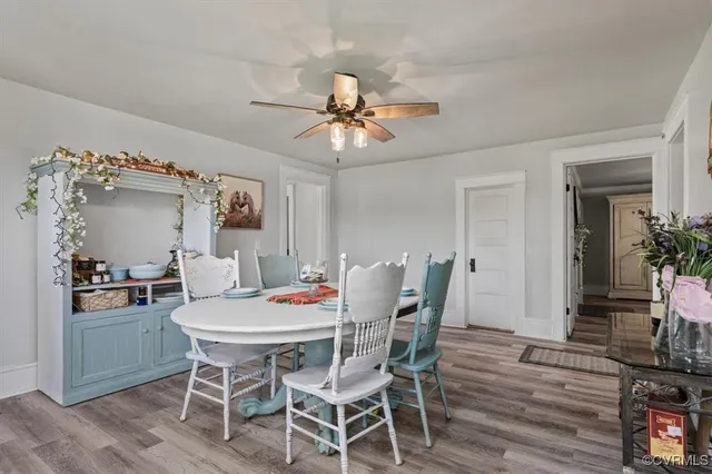 a view of a dining room with furniture window and wooden floor