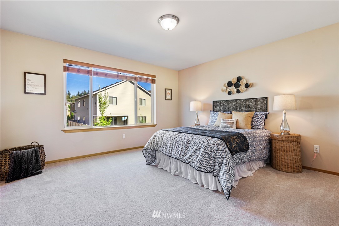 21215 40th Drive Southeast Bothell, WA 98021 - Photo 14 of 25 a bedroom with a bed and a window