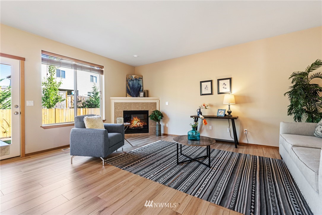21215 40th Drive Southeast Bothell, WA 98021 - Photo 3 of 25 a living room with furniture and a fireplace