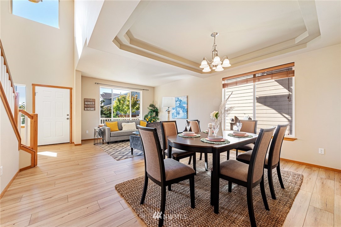 21215 40th Drive Southeast Bothell, WA 98021 - Photo 9 of 25 a view of a dining room with furniture window and wooden floor