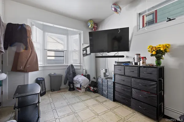 a room with furniture and a flat screen tv