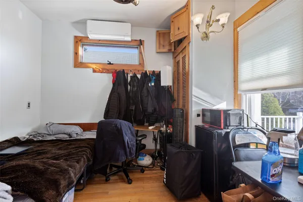 a bed sitting in a bedroom next to a window