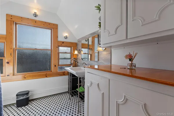 a kitchen with a sink and cabinets