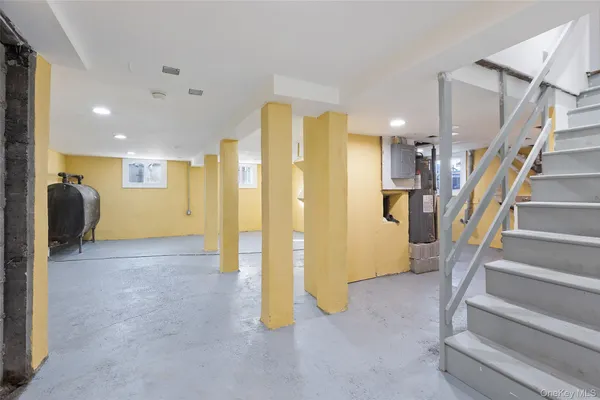 a view of a hallway with entryway and furniture