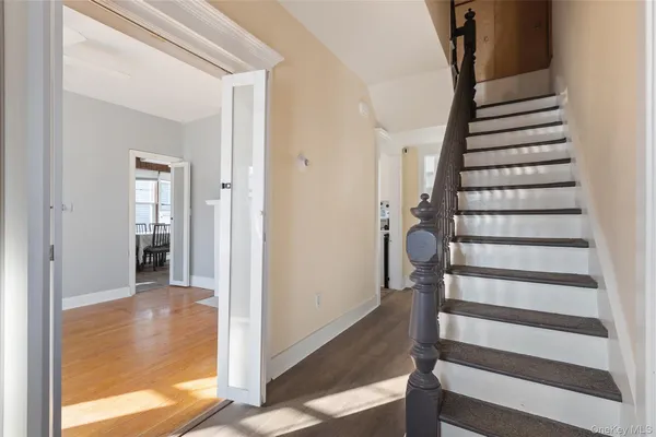 a view of entryway with wooden floor