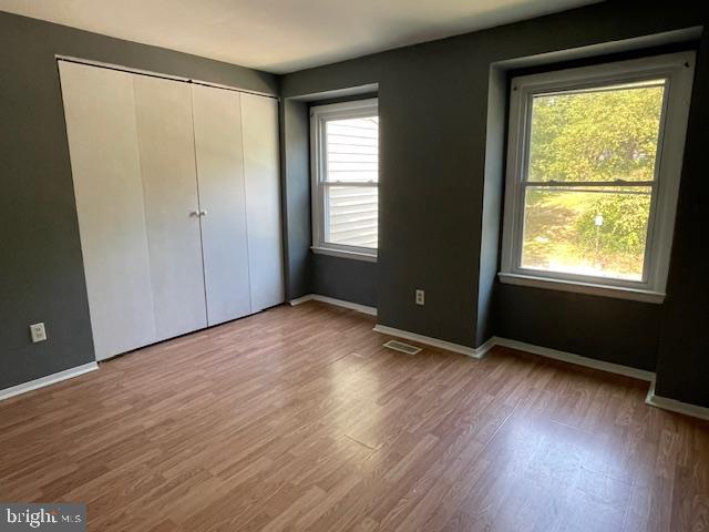 3545 Moultree Place Nottingham, MD 21236 - Photo 11 of 28 a view of an empty room with wooden floor and a window
