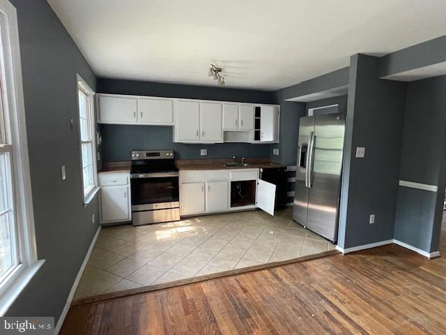 3545 Moultree Place Nottingham, MD 21236 - Photo 4 of 28 a kitchen with stainless steel appliances granite countertop a refrigerator a sink a stove and oven