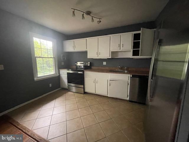 3545 Moultree Place Nottingham, MD 21236 - Photo 5 of 28 a kitchen with a sink a stove and cabinets