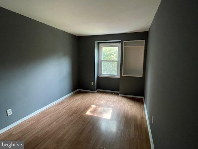 3545 Moultree Place Nottingham, MD 21236 - Photo 6 of 28 an empty room with wooden floor and windows
