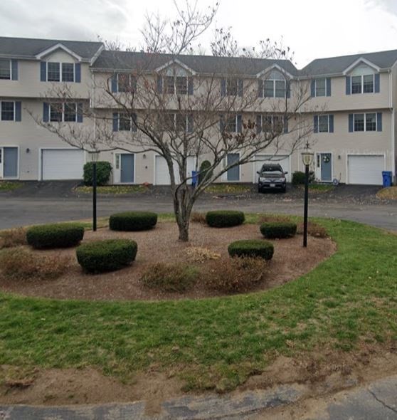 985 Trapelo Road, Unit 6 Waltham, MA 02452 - Photo 1 of 14 a view of a house with backyard and sitting area