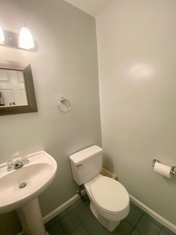 985 Trapelo Road, Unit 6 Waltham, MA 02452 - Photo 12 of 14 a bathroom with a toilet a sink and mirror