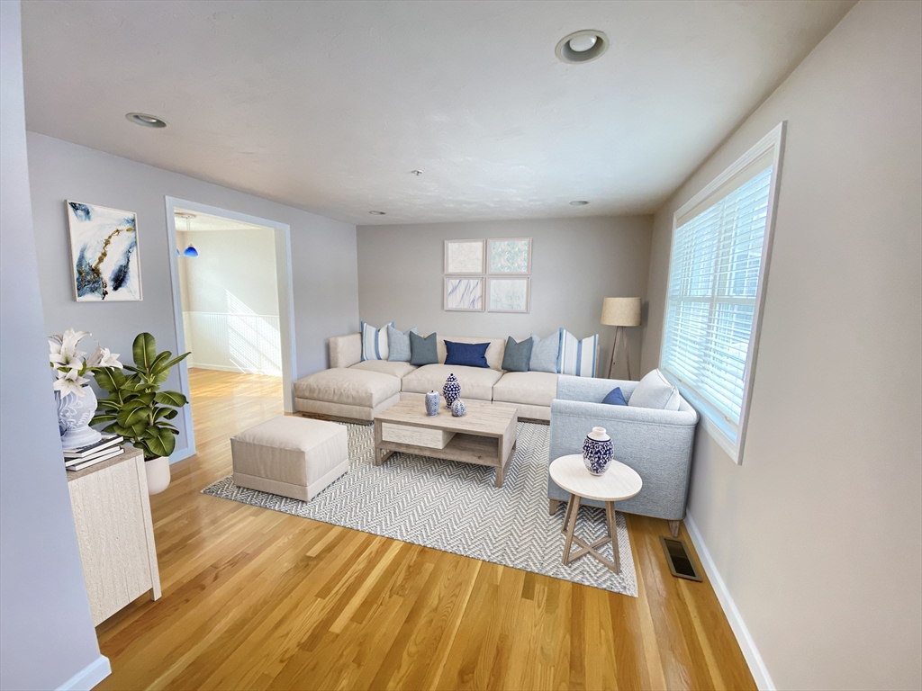 985 Trapelo Road, Unit 6 Waltham, MA 02452 - Photo 2 of 14 a living room with furniture and a table