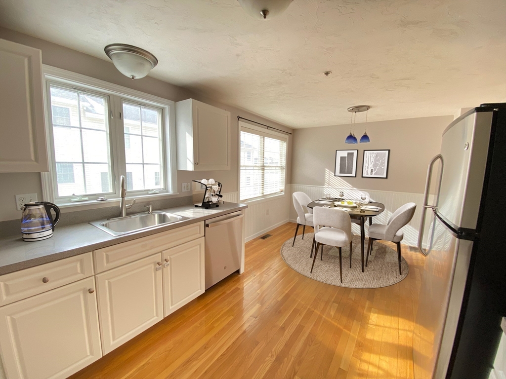 985 Trapelo Road, Unit 6 Waltham, MA 02452 - Photo 4 of 14 a view of a dining room with furniture and window