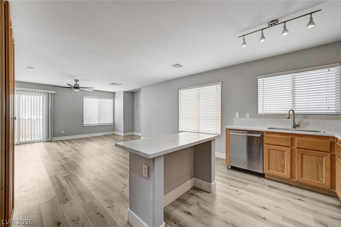 7259 Cestrum Road Las Vegas, NV 89113 - Photo 12 of 35 A versatile open-concept kitchen and living area, perfect for entertaining.