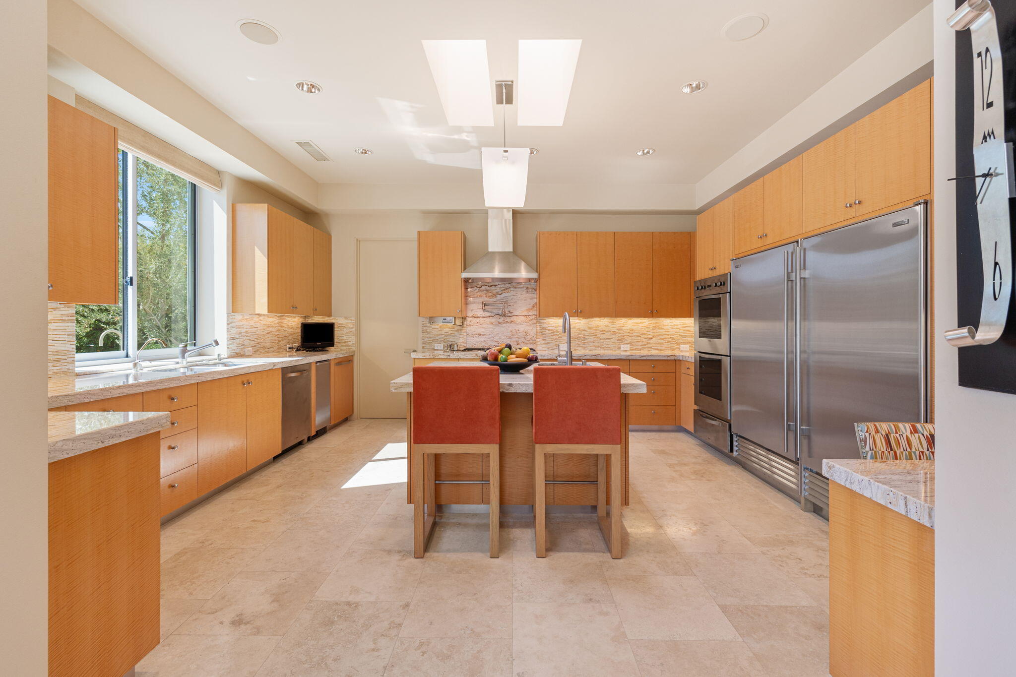 28 Sun Ridge Circle Rancho Mirage, CA 92270 - Photo 19 of 59 a dining hall with stainless steel appliances a dining table and a large window