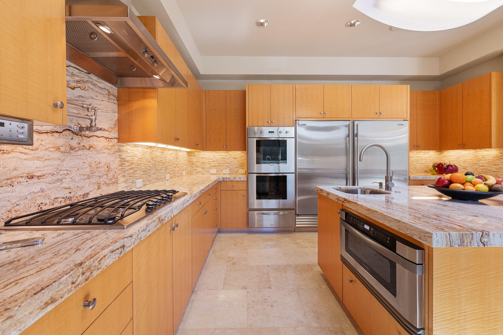 28 Sun Ridge Circle Rancho Mirage, CA 92270 - Photo 22 of 59 a kitchen with stainless steel appliances granite countertop a stove a sink and a refrigerator