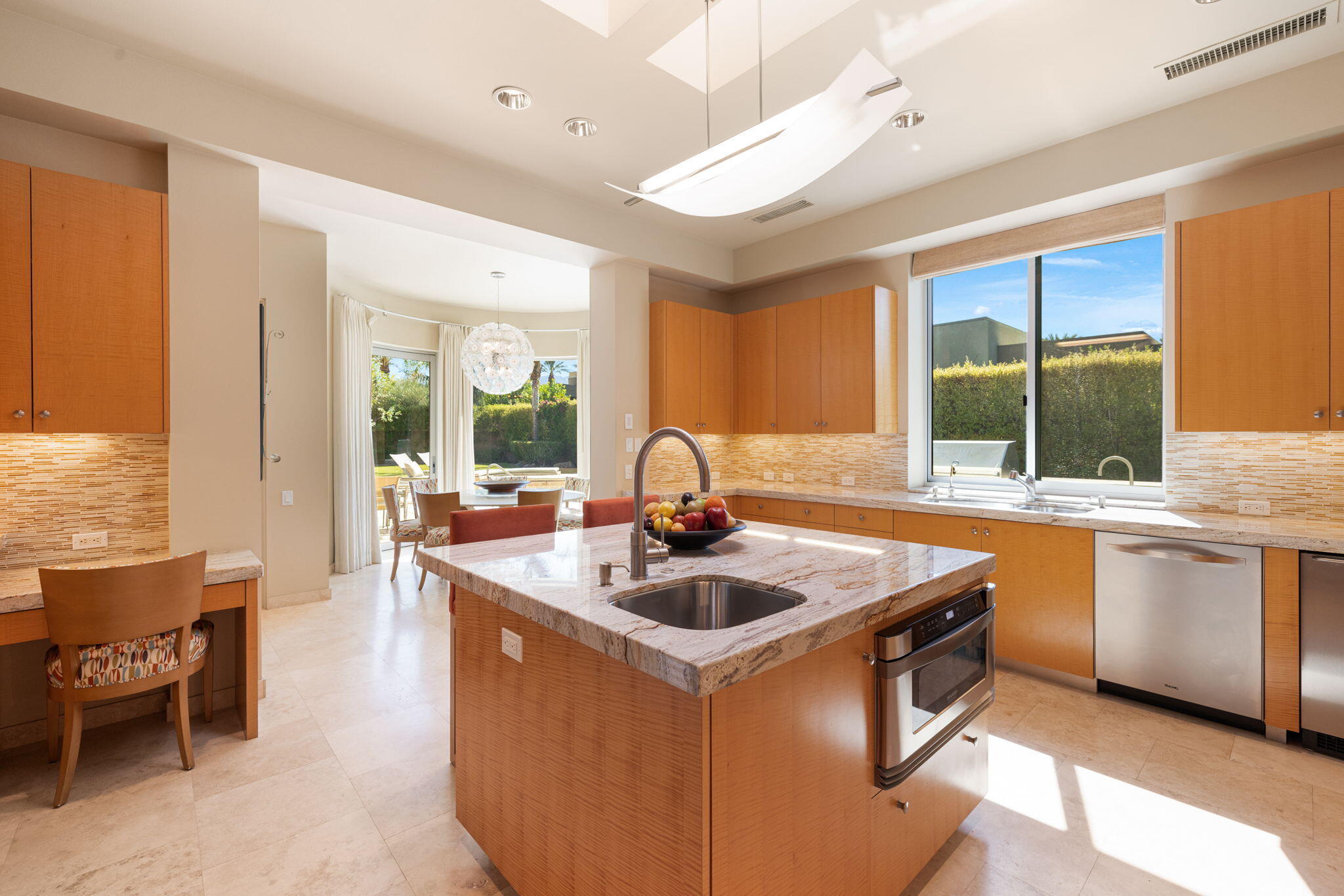 28 Sun Ridge Circle Rancho Mirage, CA 92270 - Photo 23 of 59 a kitchen with stainless steel appliances granite countertop a sink stove and cabinets