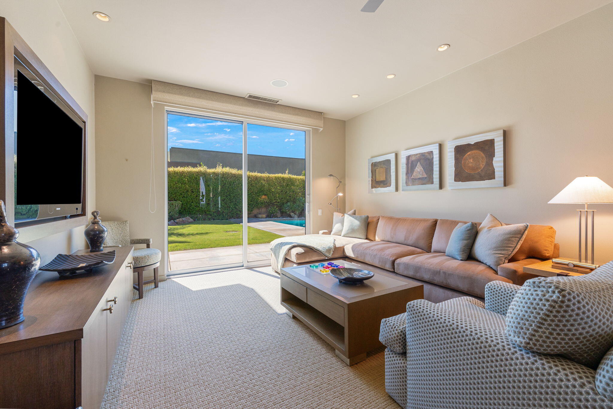28 Sun Ridge Circle Rancho Mirage, CA 92270 - Photo 25 of 59 a living room with furniture and a flat screen tv