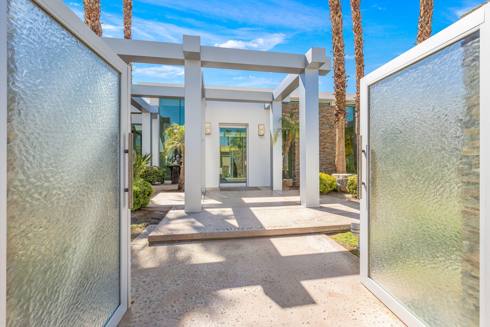 28 Sun Ridge Circle Rancho Mirage, CA 92270 - Photo 3 of 59 a view of a glass door with a glass door