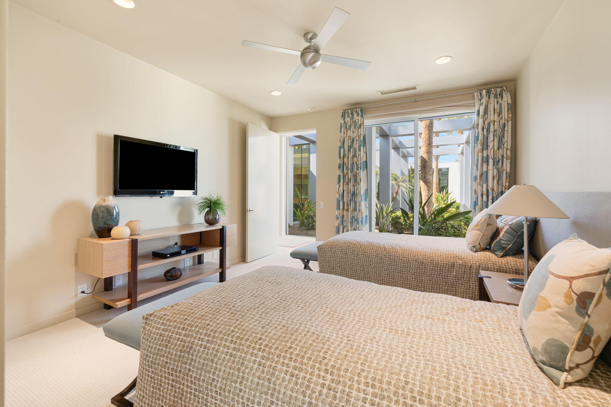 28 Sun Ridge Circle Rancho Mirage, CA 92270 - Photo 38 of 59 a bedroom with a bed and a flat screen tv