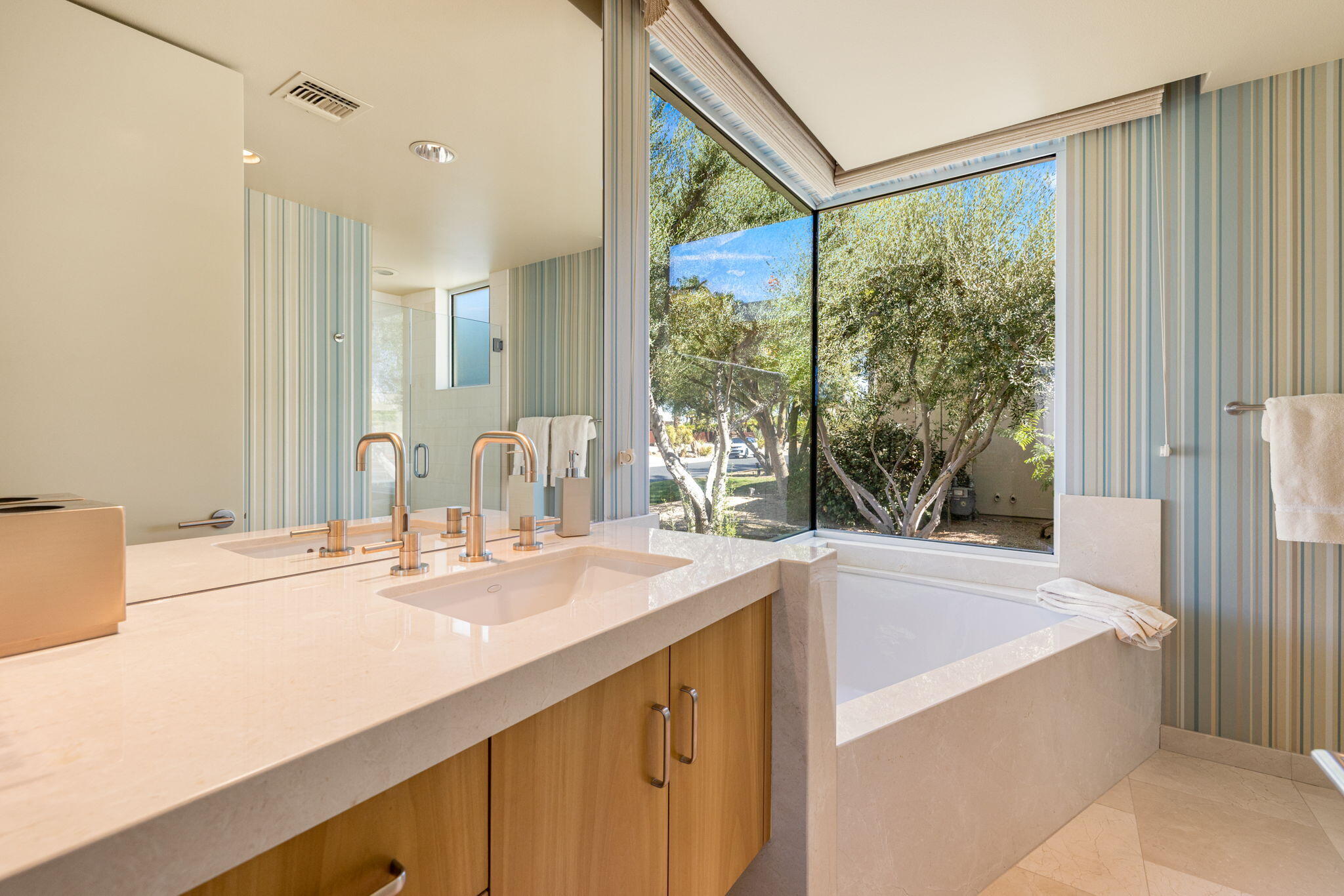 28 Sun Ridge Circle Rancho Mirage, CA 92270 - Photo 39 of 59 a bathroom with a granite countertop sink and a large mirror