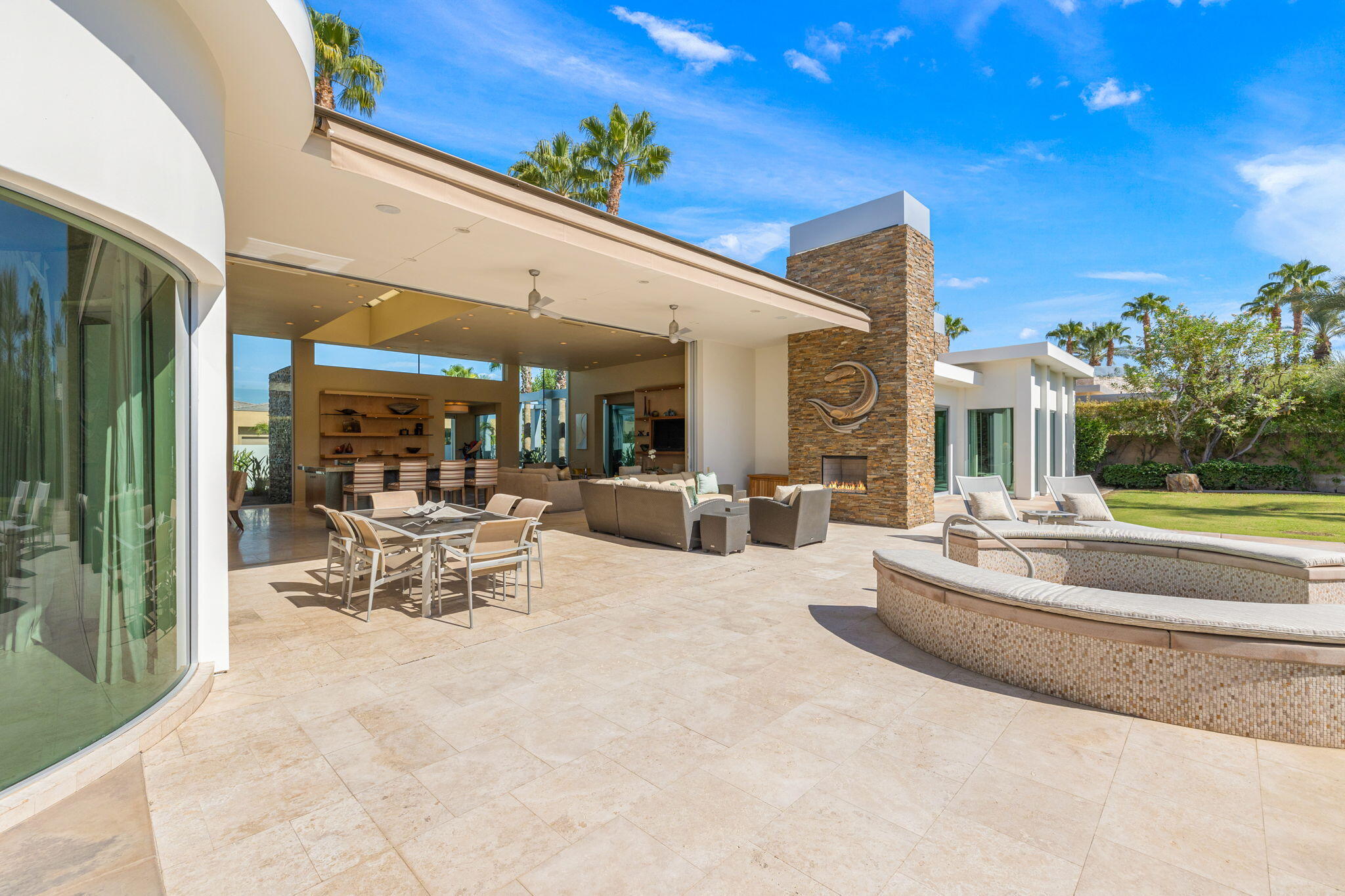 28 Sun Ridge Circle Rancho Mirage, CA 92270 - Photo 53 of 59 a view of a patio with dining table and chairs with plants