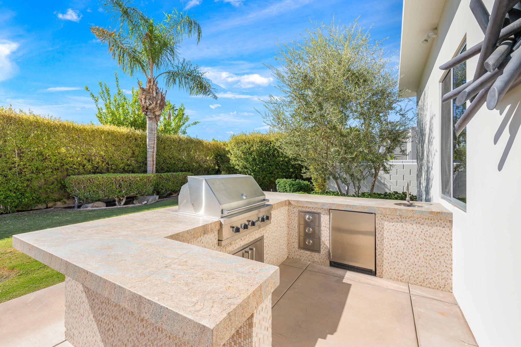 28 Sun Ridge Circle Rancho Mirage, CA 92270 - Photo 55 of 59 a view of a patio with table and chairs and potted plants