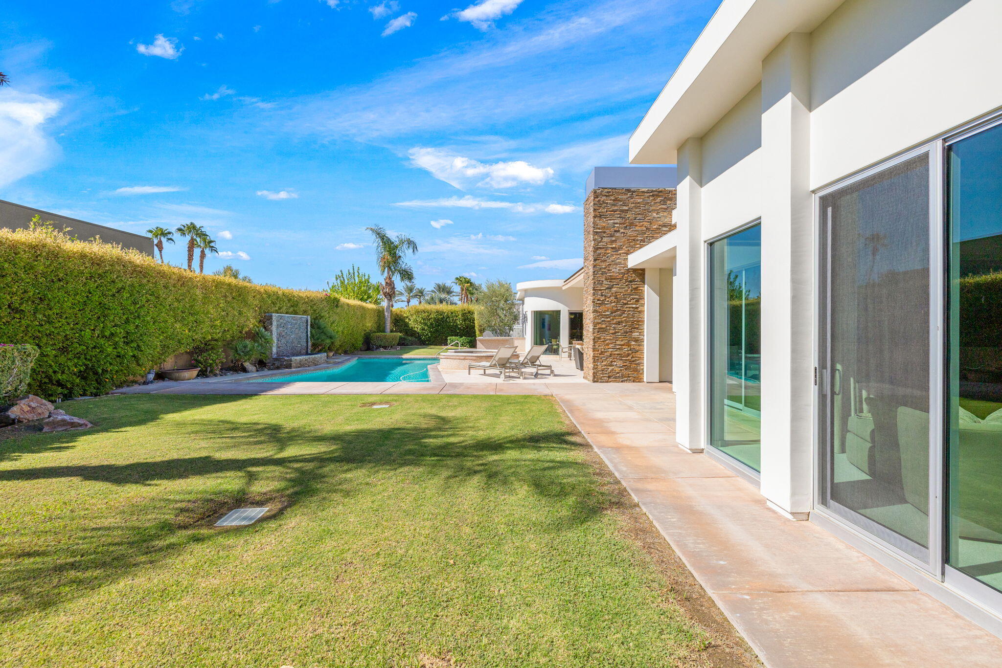 28 Sun Ridge Circle Rancho Mirage, CA 92270 - Photo 56 of 59 a view of an house with backyard porch and outdoor space