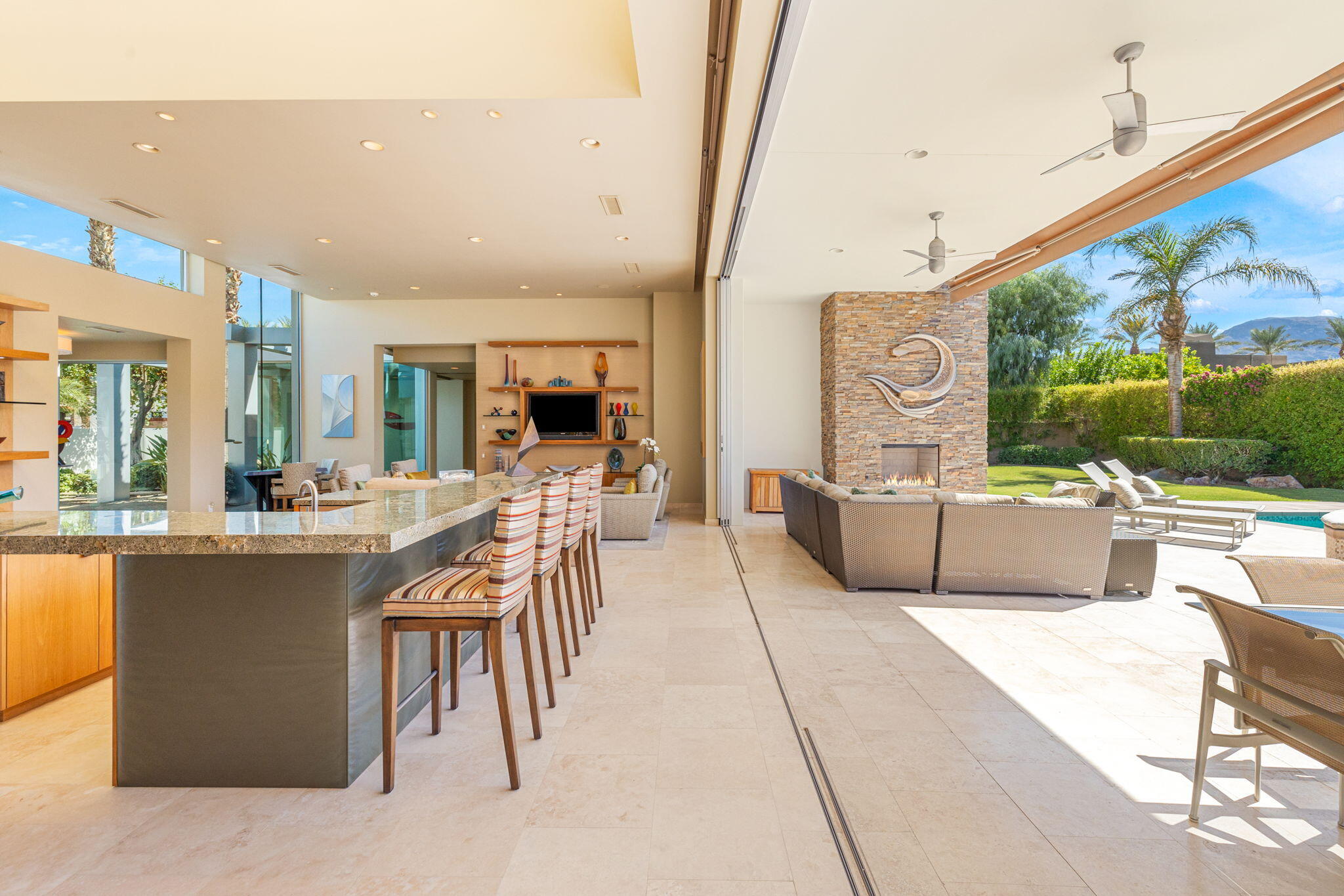 28 Sun Ridge Circle Rancho Mirage, CA 92270 - Photo 10 of 59 a living room with couches a flat tv screen and a coffee table
