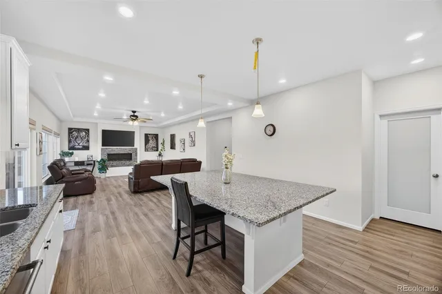 an open kitchen with a table and chairs