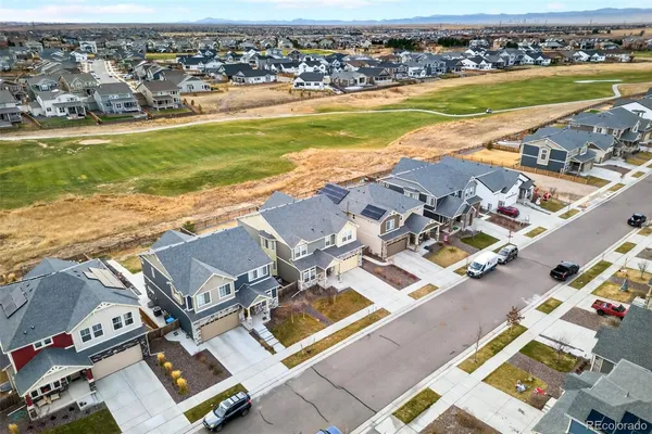 an aerial view of residential houses with outdoor space
