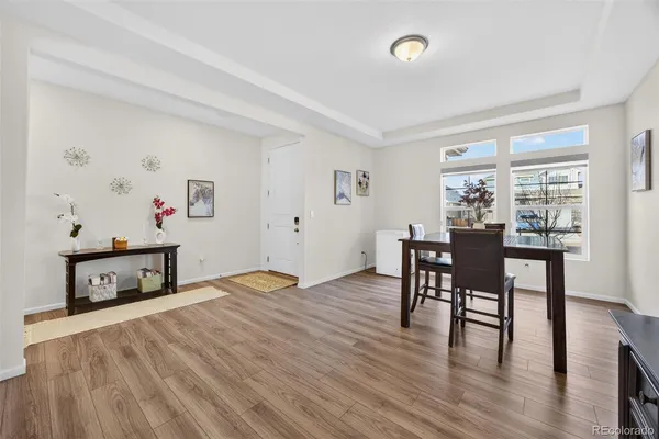 a bedroom with furniture and a wooden floor