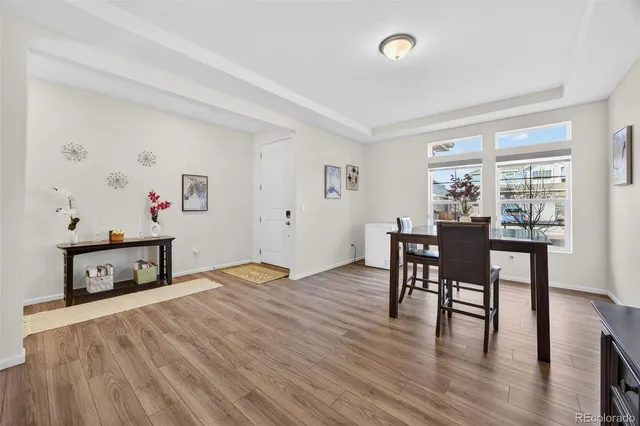 a bedroom with furniture and a wooden floor