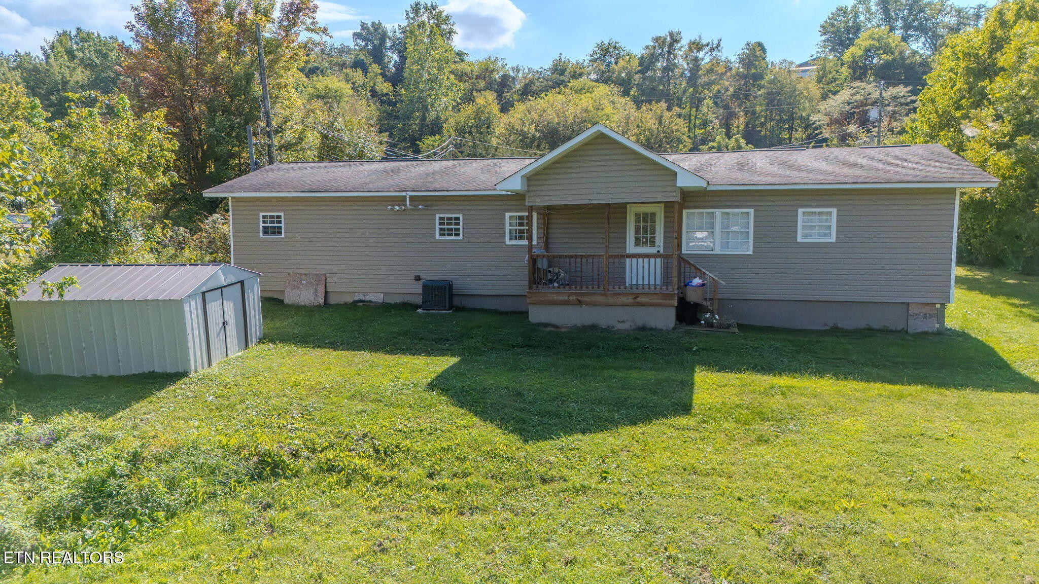 2331 Webb Road Sevierville, TN 37876 - Photo 20 of 23 a front view of a house with a yard and garage