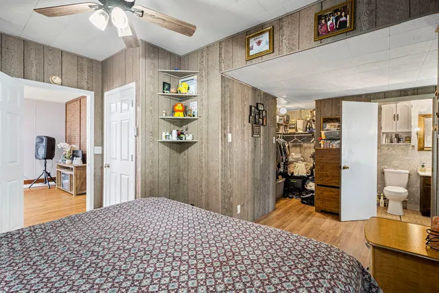 a bedroom with a bed and a view of bedroom