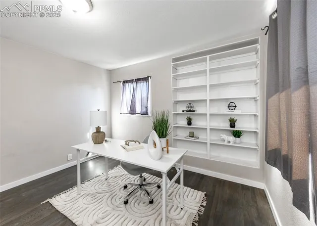 a workspace with furniture and window